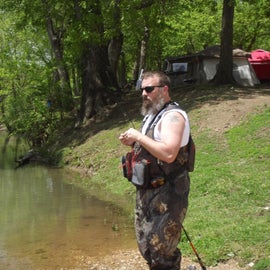 My husband trout fishing