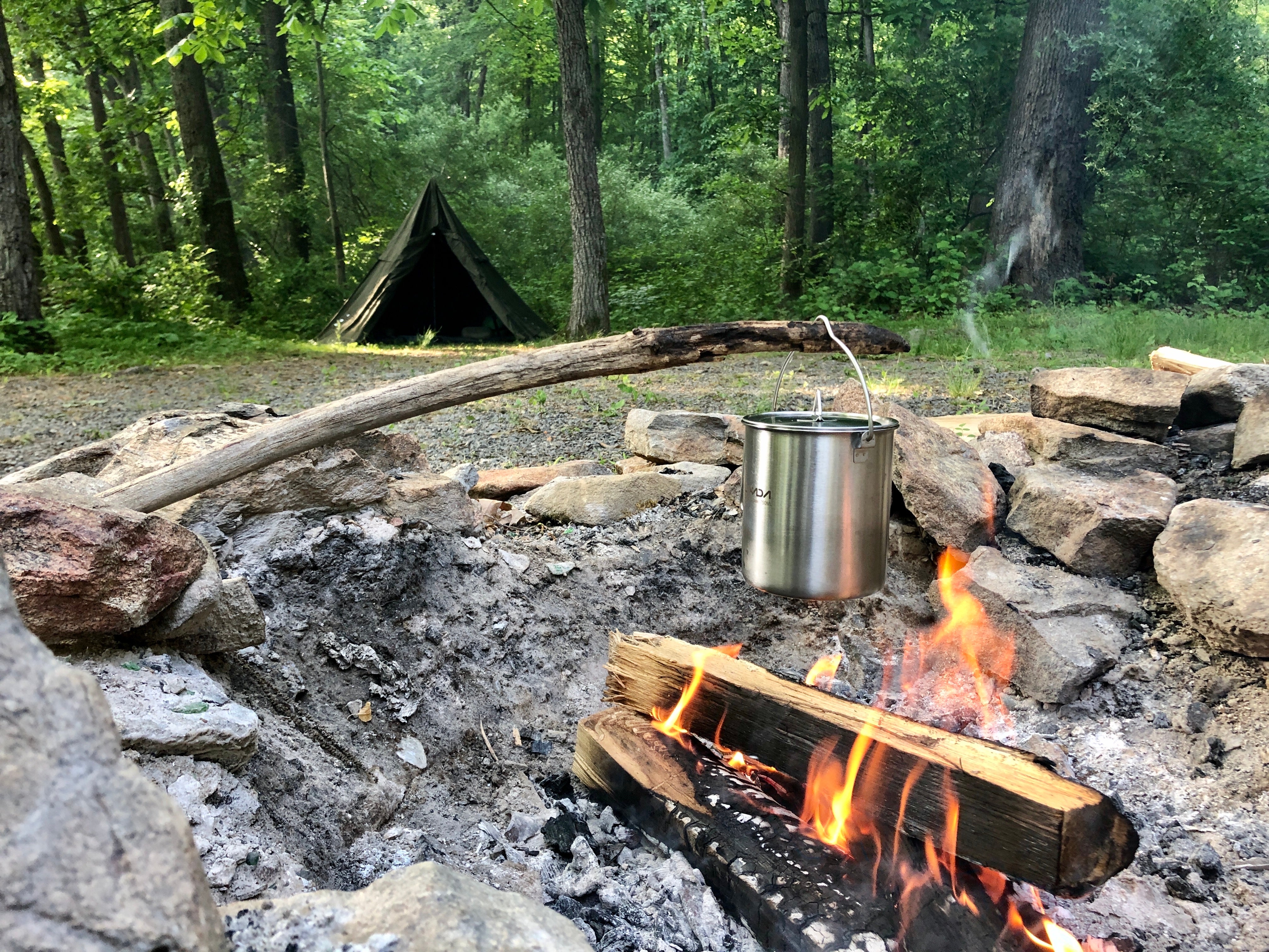 Fire cooking and sleeping under the trees