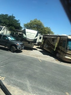 The fifth wheel parked on the line and extended his slides into the space for the other site.  Motorhome could not extend awning.  This was common across the park.