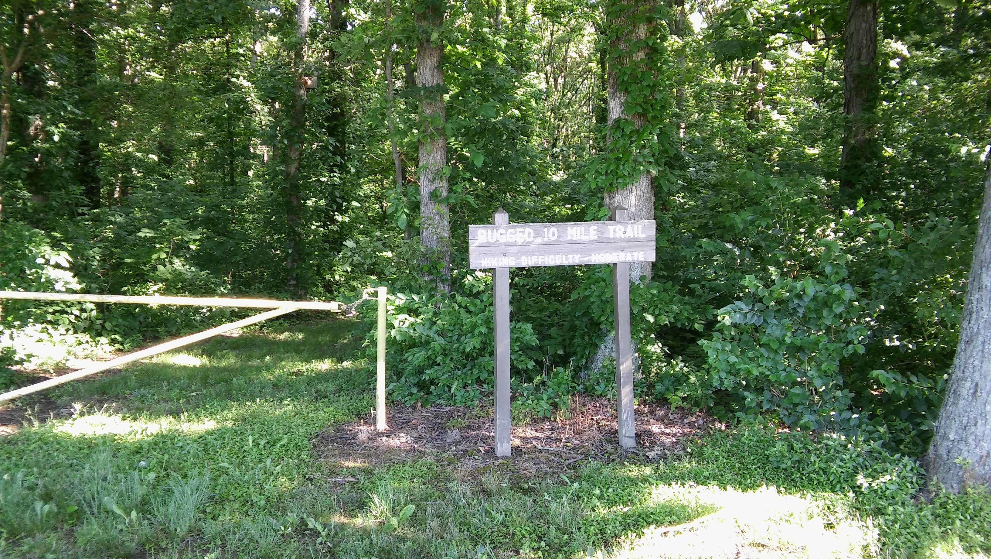 Trail sign at start of a hiking trail.  Not all trails are rugged.  Some are easy to hike.