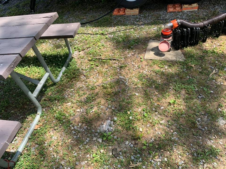 neighbors sewer pipe next to picnic table