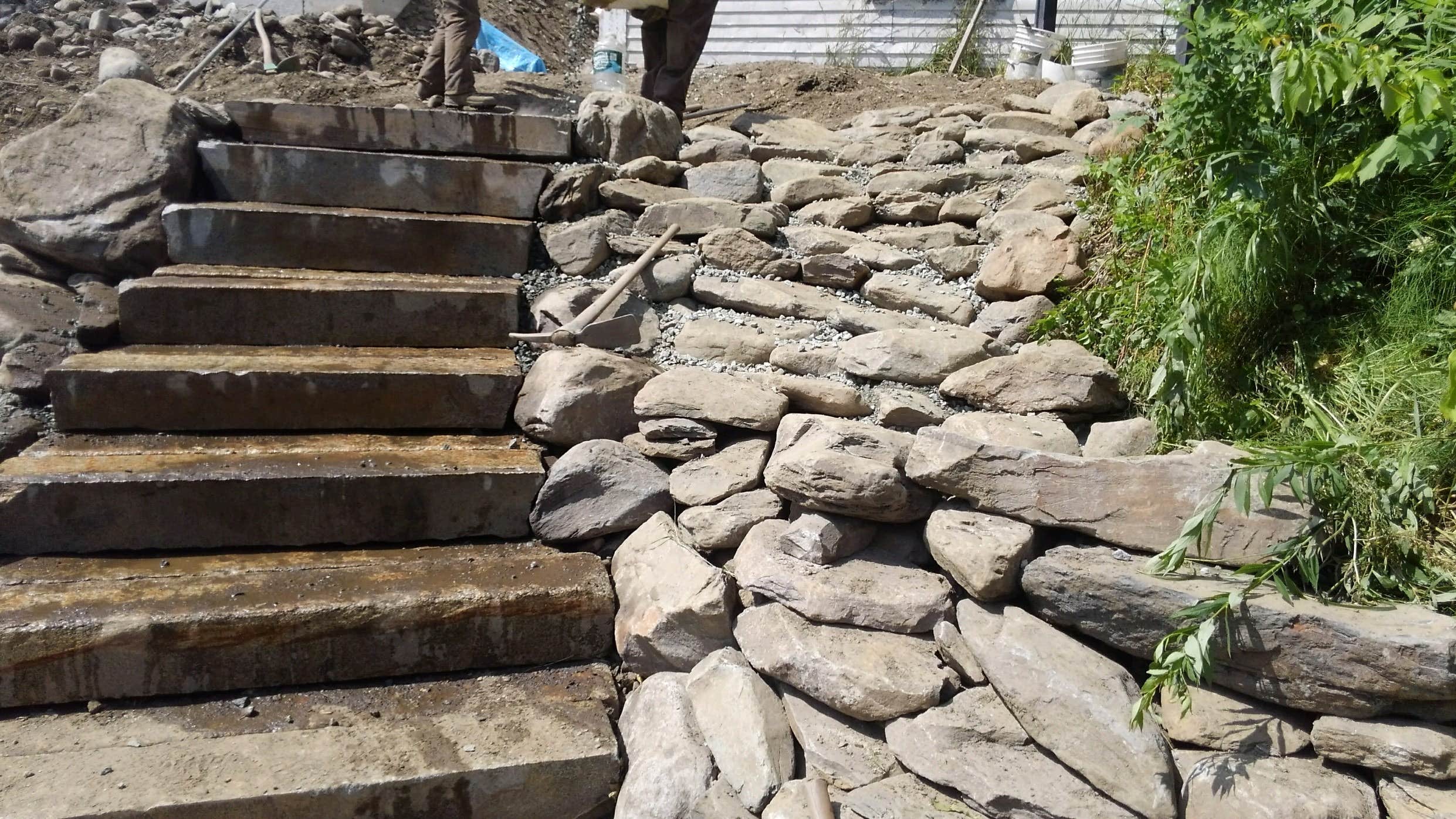 New granite stairs leading down to the river at the Beecher Falls Access area