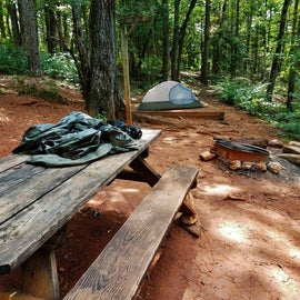 Campsite 4 has just the basics--fire pit, picnic table, lantern pole, and tent pad.