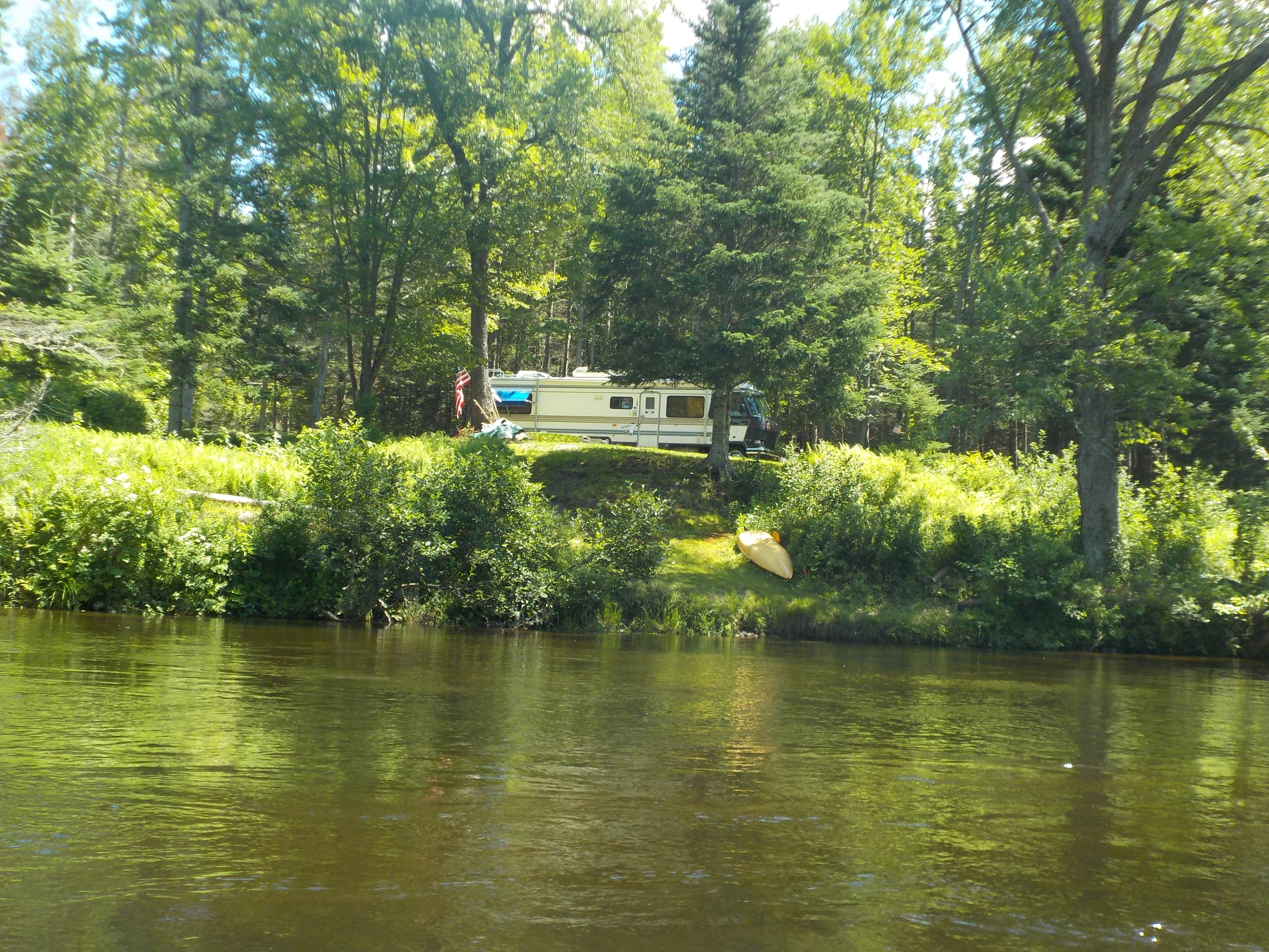 Campsite with a grassy landing for beaching your boat.