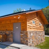 Clean campground restrooms, coin operated showers, recycling bins for campers