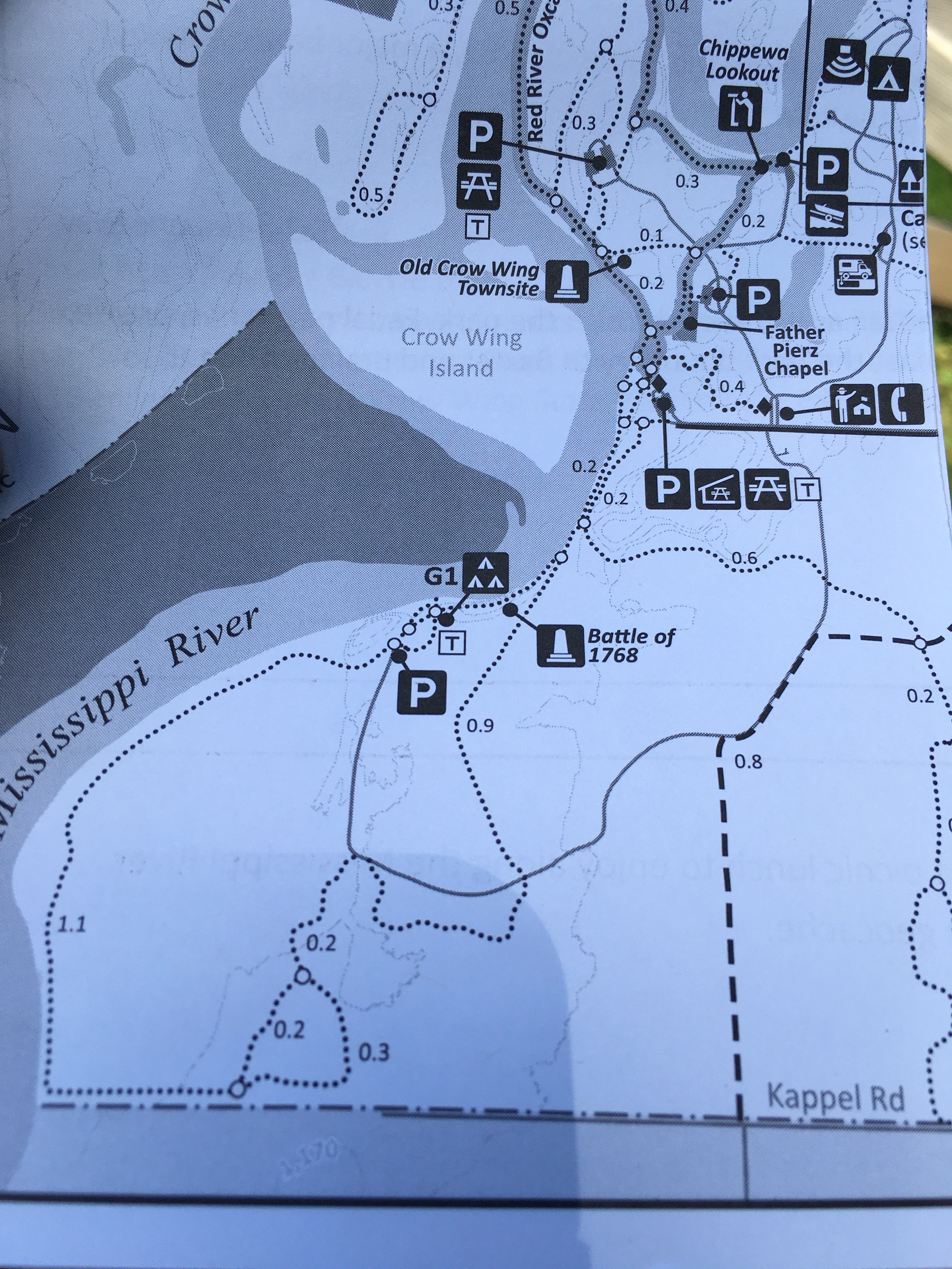 The canoe campsite is not currently highlighted on the park map. The group camp is actually located by the "G1" notation, and the canoe campsite is adjacent but a bit to the north east between the three tent icon and the little sandbar in the river.