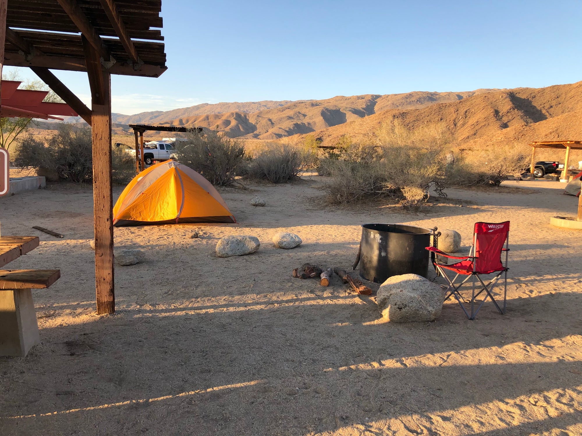 tent campsite with shaded picnic tables at Borrego Palm Canyon Campground
