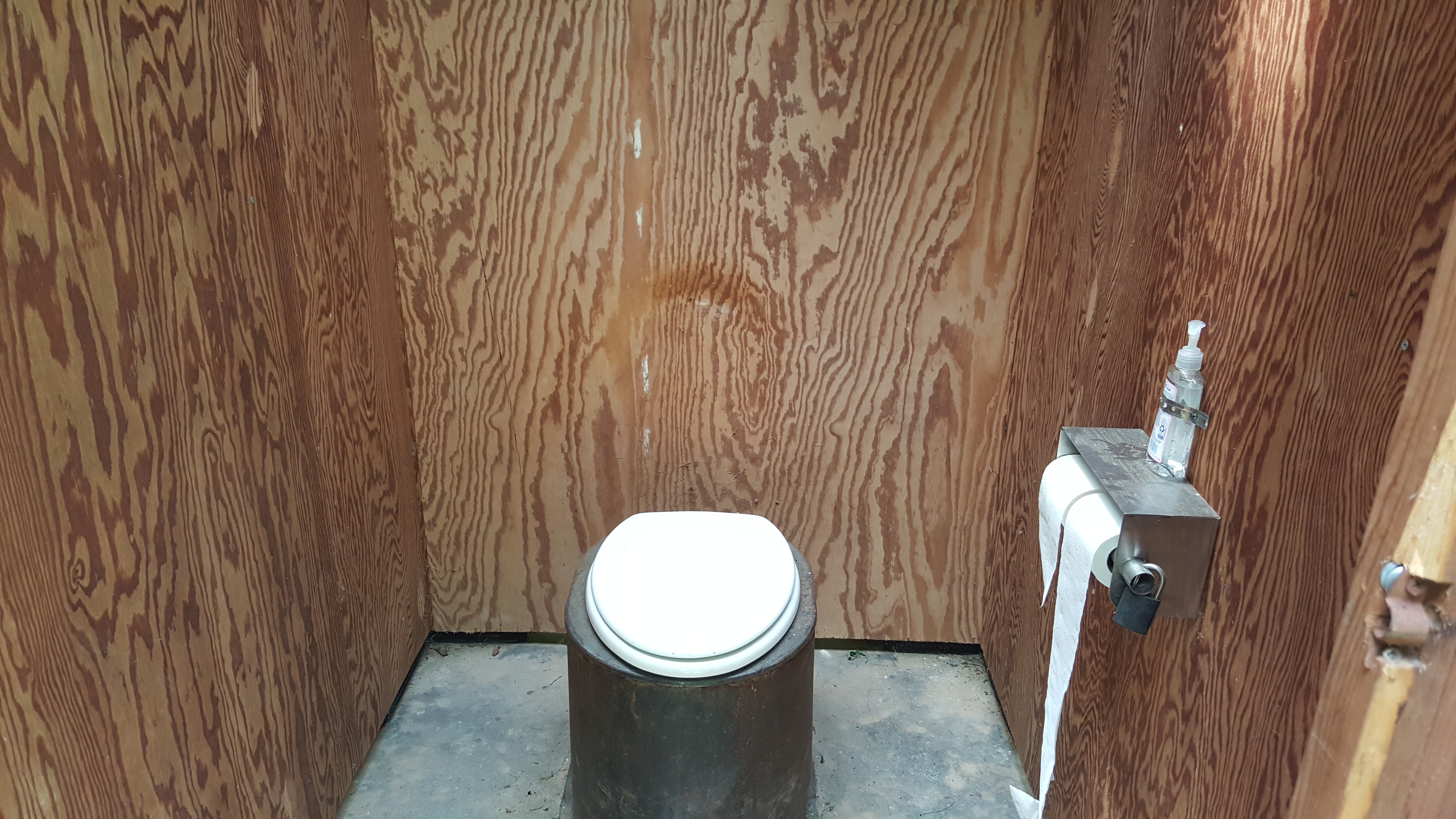 It is a vault toilet but one of the best I have been to in terms of being clean. Toilet paper and hand sanitizer provided