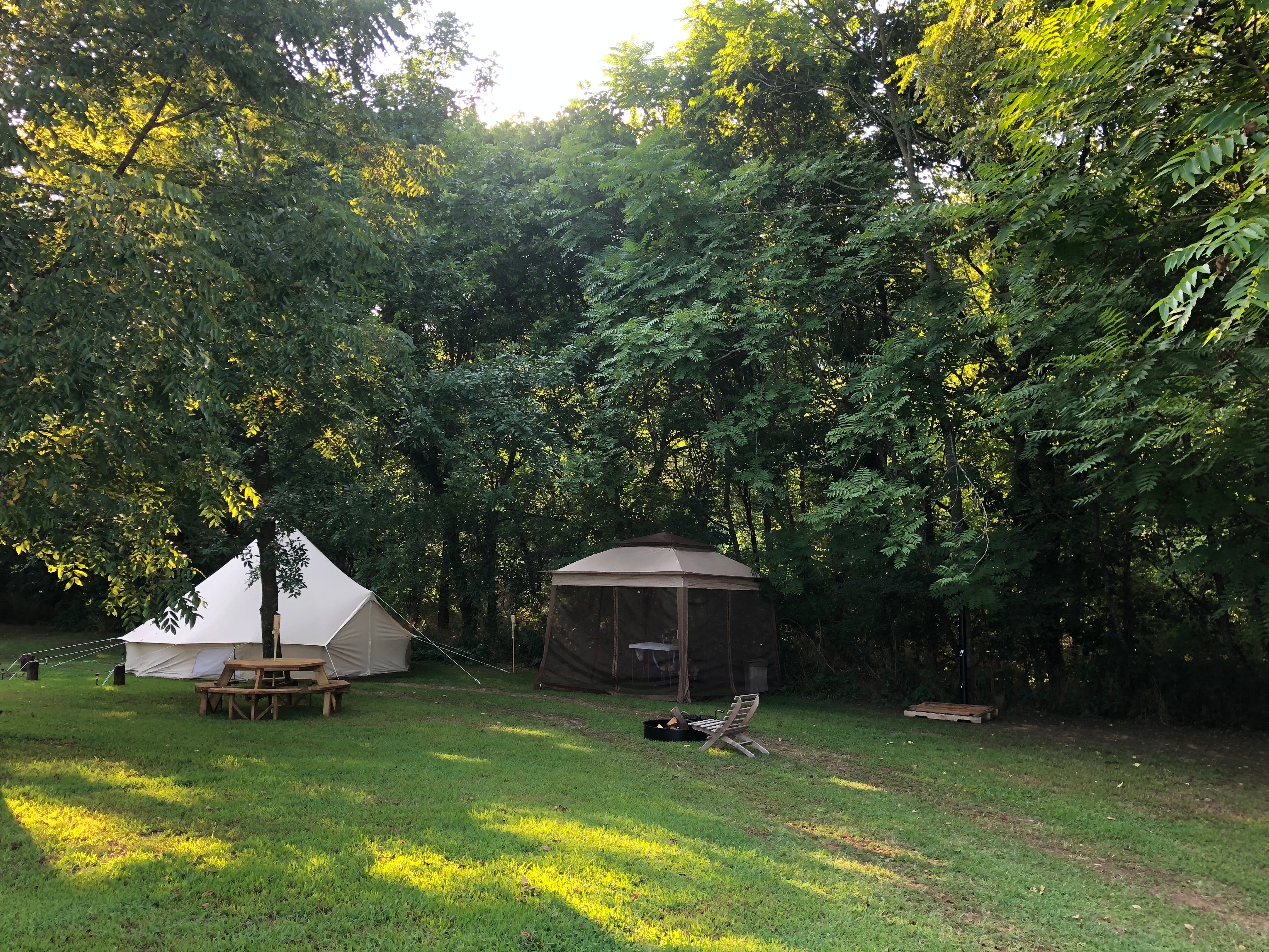 Beautiful shady campsite right by the river. Everything you need to enjoy a week or weekend by water!