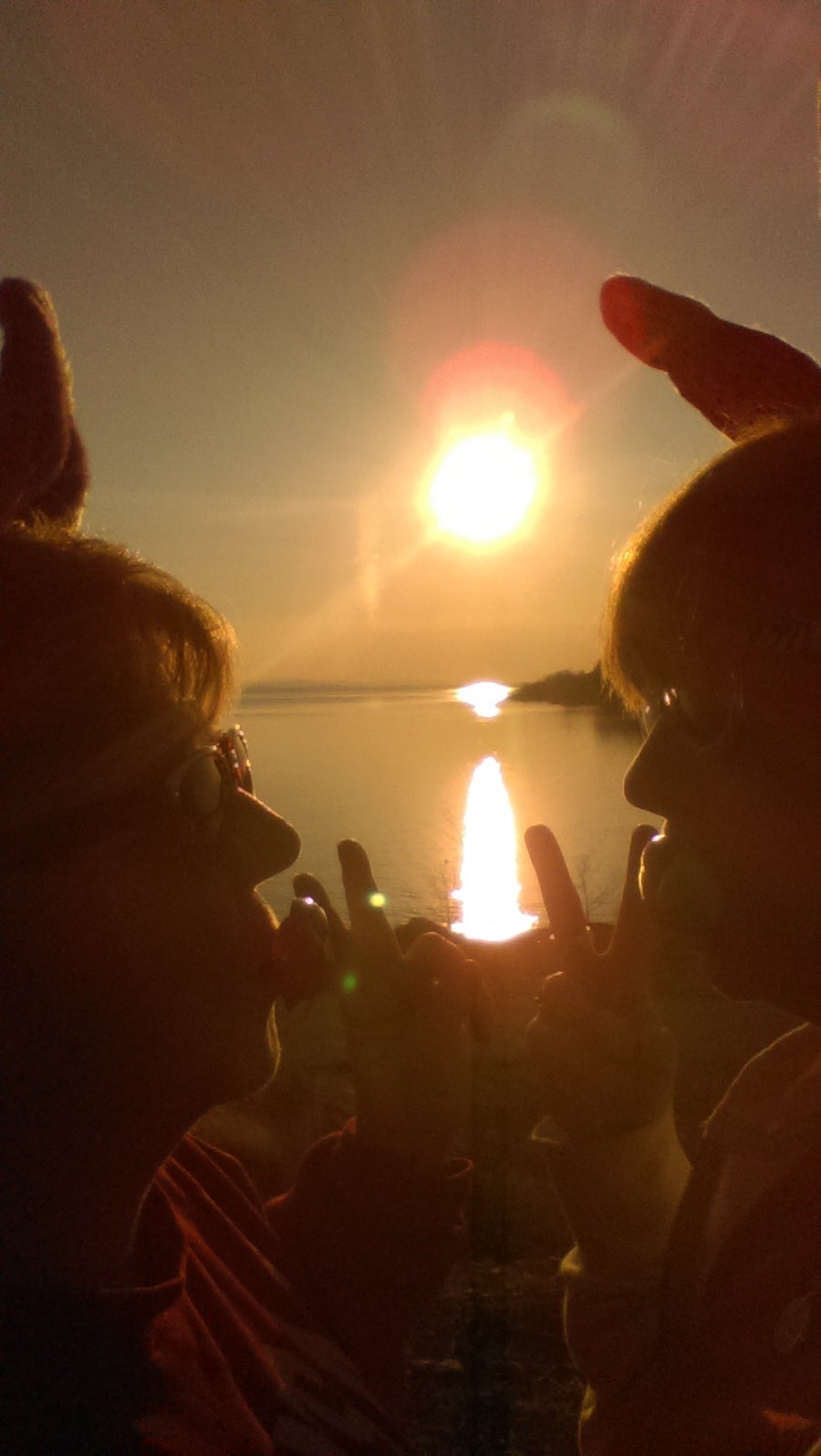 We like to have fun so here's our bunny ears and the sunset!