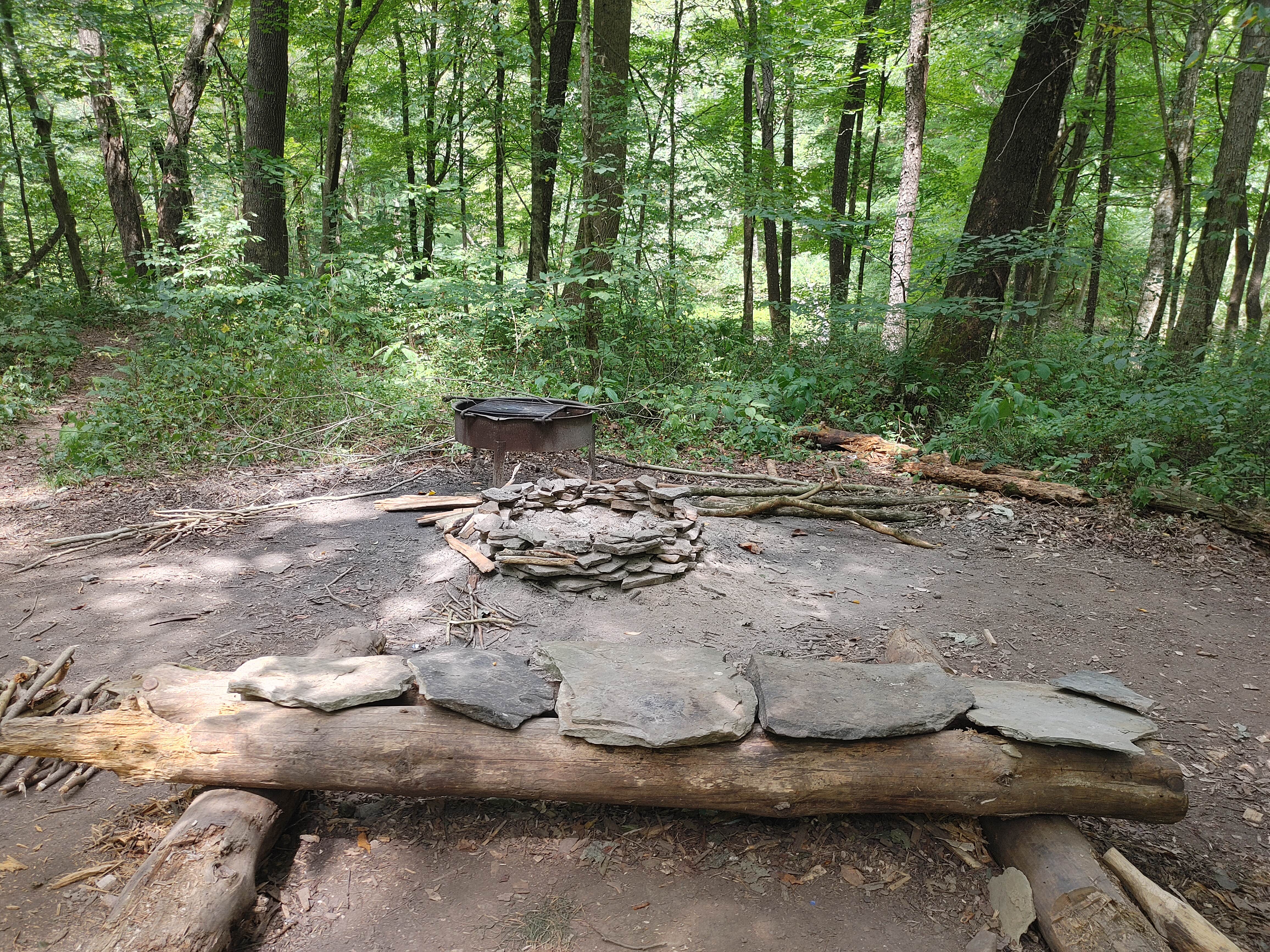 Love the creative rock bench for sitting by the fire.