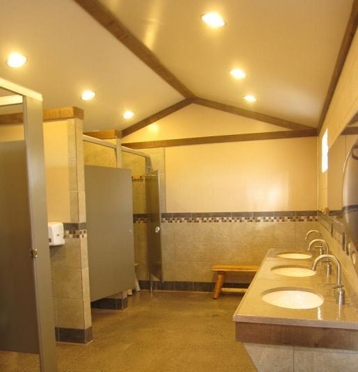 Clean bathrooms with wide private shower stalls - main bathhouse