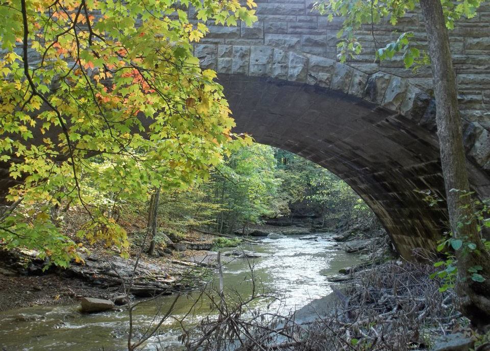 An old stone bridge over a river at McCormicks Creek State Park