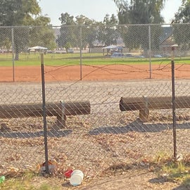 The baseball field, just on the other side of the gate.