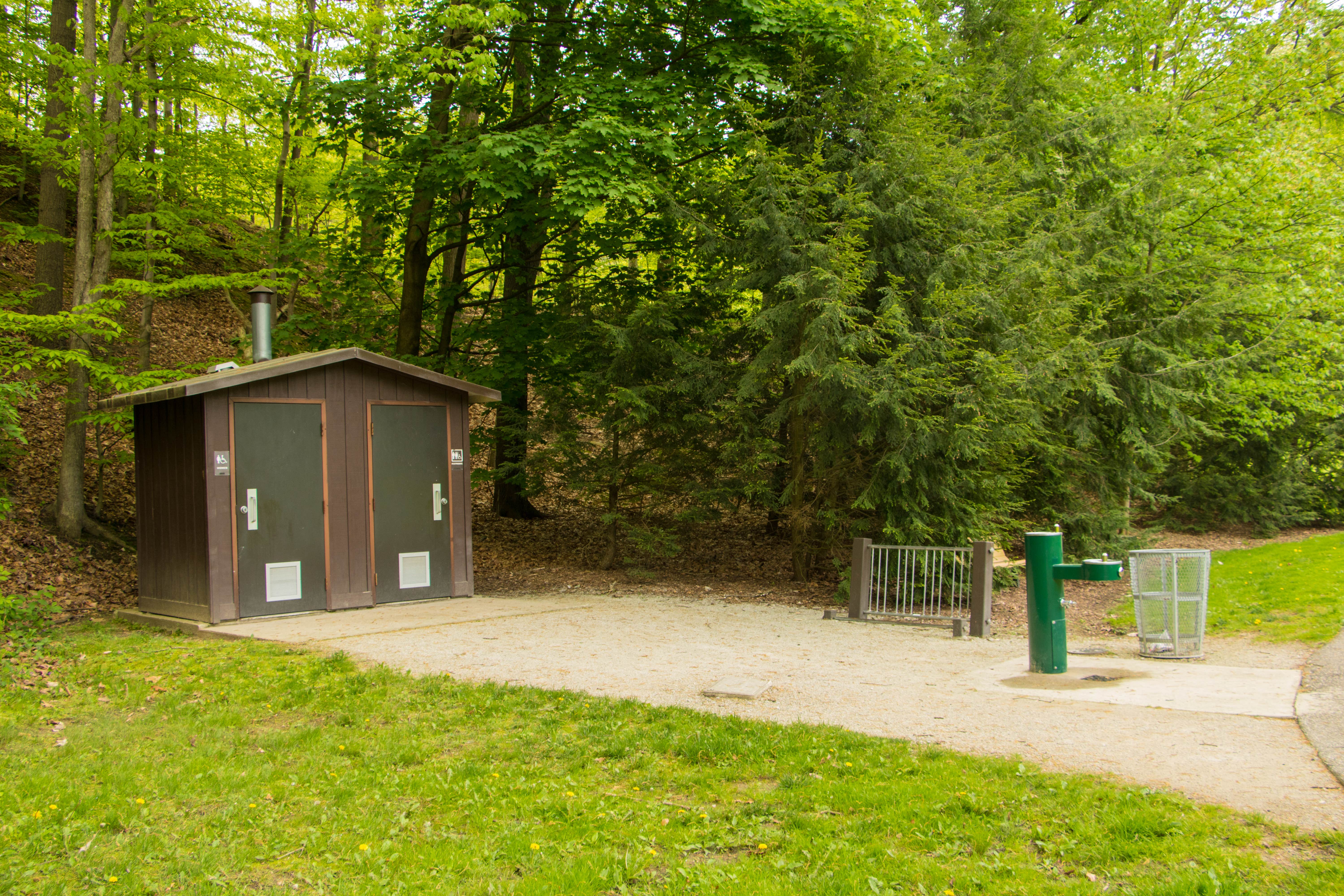 Website says no toilets or water, but there are both available just down the hill from the camping area.