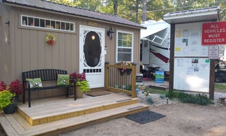 Camping near Hill & Hollow Campground & RV Park: Whispering Surf Campground at Bass Lake, Pentwater, Michigan