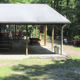 Pavilion w tables, large display, and fire pit