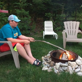 3rd grandson waiting for everyone to gather round the fire.