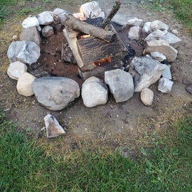 I love how they have the rocks lining the firepits, makes it so pretty!