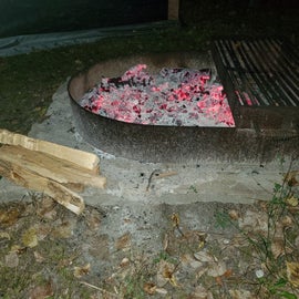 This is what their fire pit looks like. It has a grate that you can cook on!