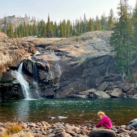 My daughter at the pool at the base of Tuolumne Falls, right next to camp.