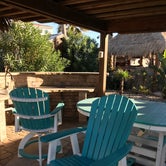 Tiki hut with wet sink and nice patio furniture