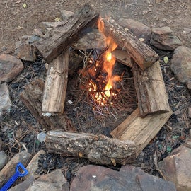Got a little fire going to try to dry out the bigger logs, not much luck though.