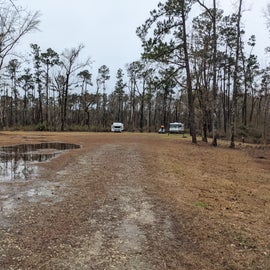 RV sites are all lined up in a row in a big open field