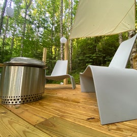 Boone Cocoon deck with cool lounge chairs and solo stove fire pit