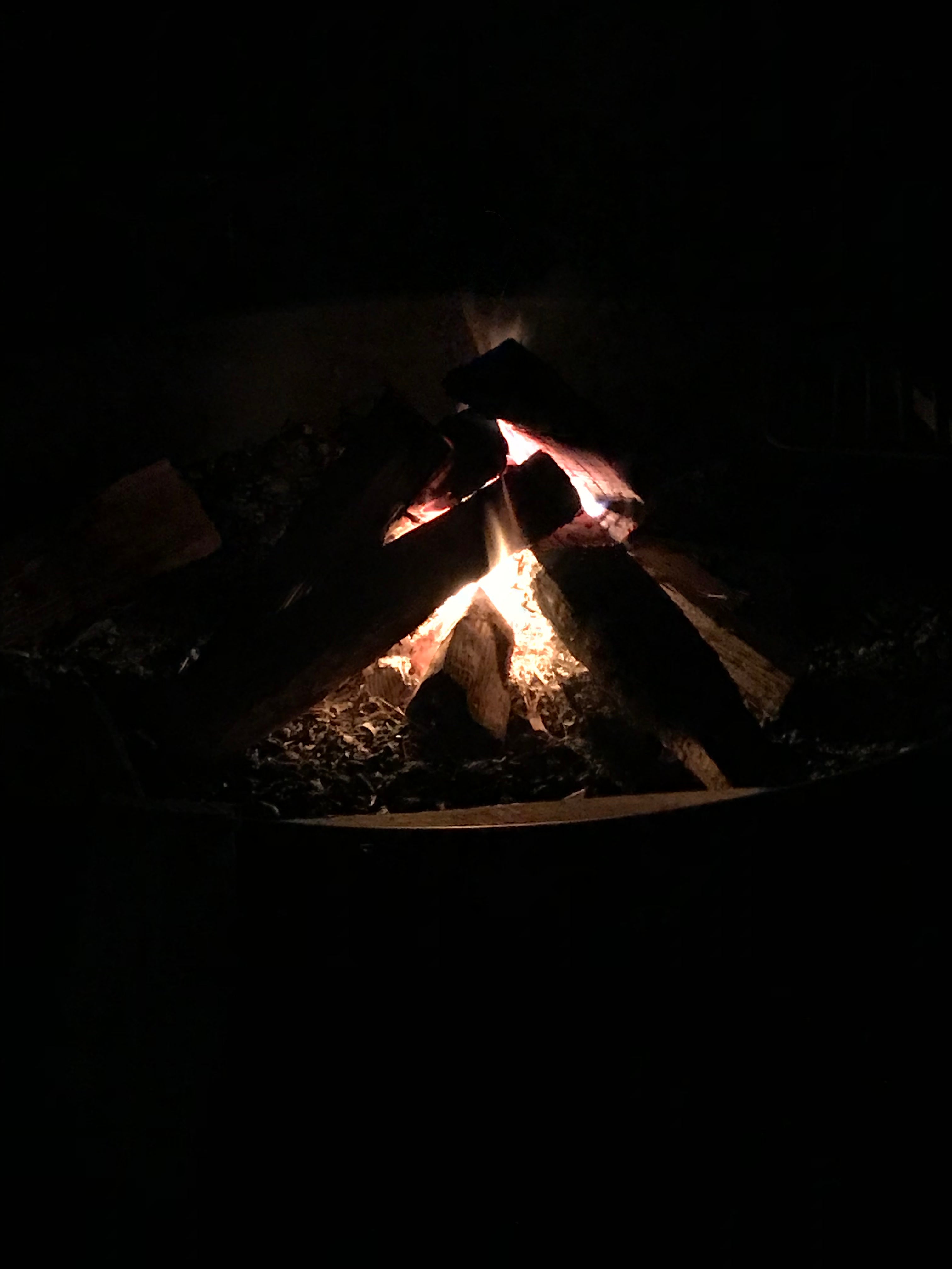 Warm campfire in a cold spring night. 