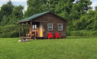 Camping near Jackson Pond Tent Sites: Off Grid Sunset View Sleeping Cabin, Earlville, New York