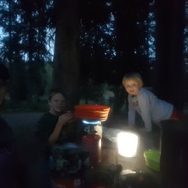 Eating at the picnic table, it got dark on us on the first night. But we do love our solar lamp for fun at night.