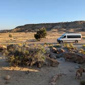 Review photo of campsite with two picnic tables and the shelter of a couple trees by DL M., September 14, 2024